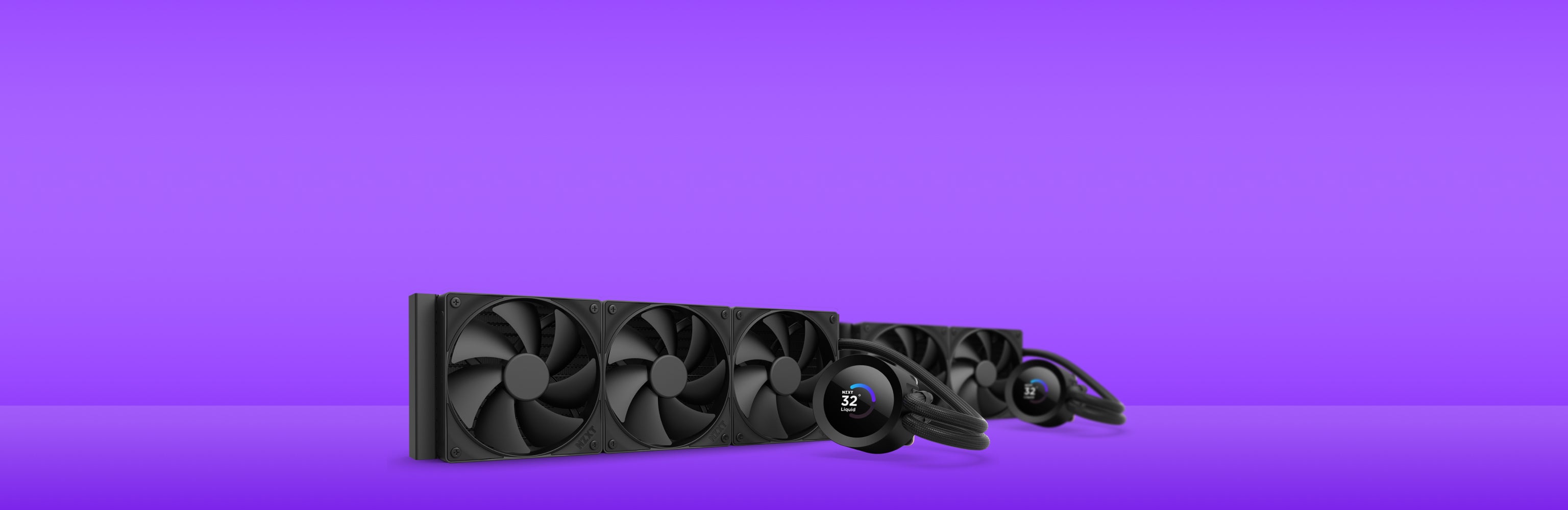 Three black computer cooling fans and water cooling pump units are arranged on a smooth, reflective surface against a bright purple background.