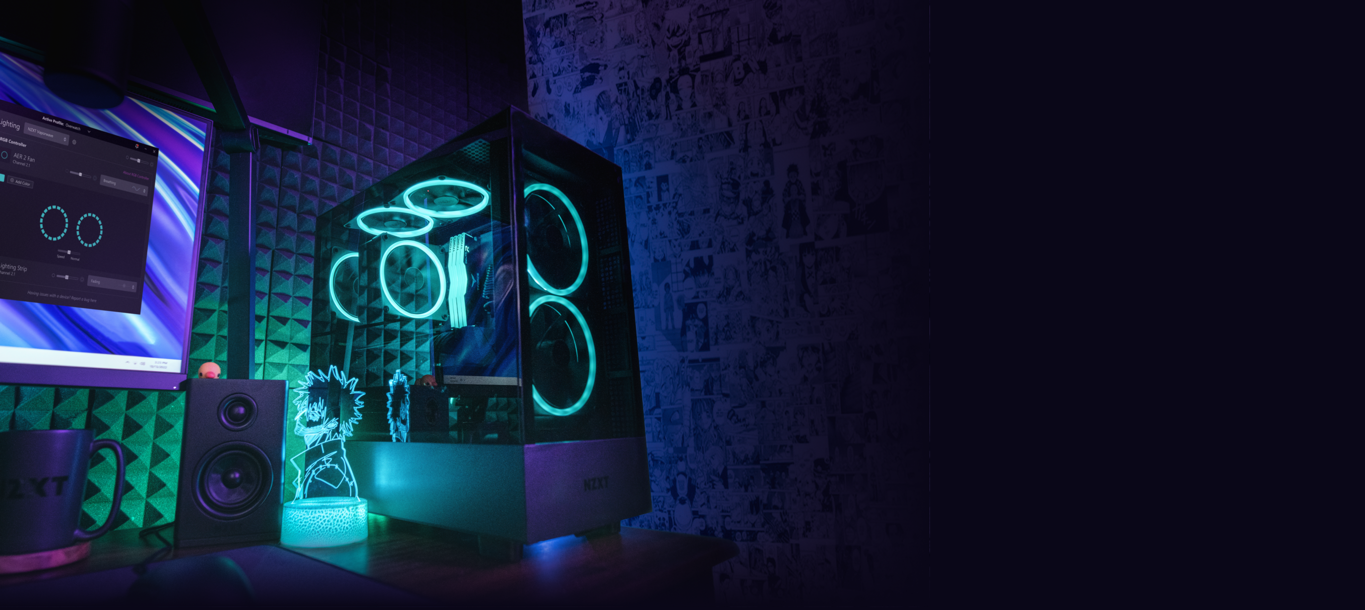 A glowing gaming PC with blue LED fans sits on a desk beside a monitor, a speaker, a cup, and an anime figurine, against a wall decorated with black and white anime art.