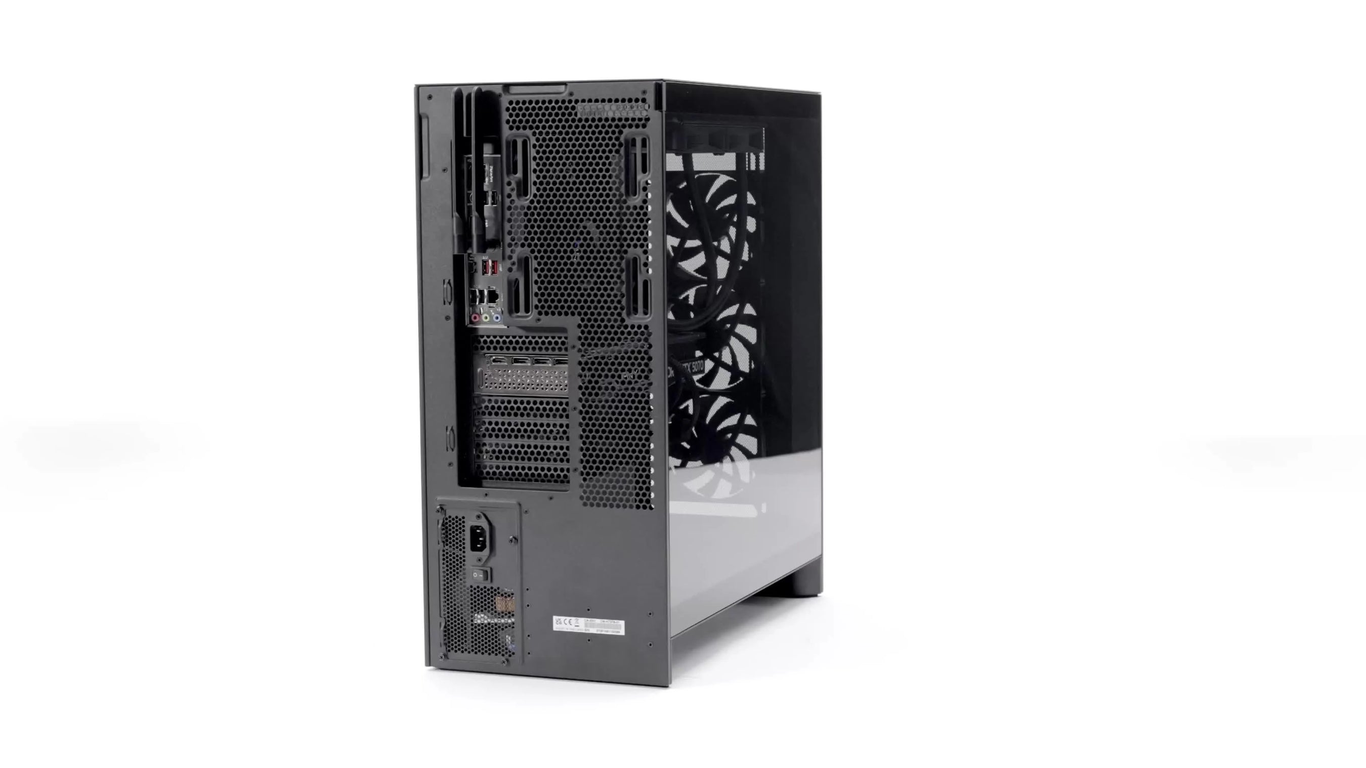 A black desktop computer tower viewed from the back and side, showing ventilation grilles, ports, connectors, power supply, and three visible cooling fans inside the case.