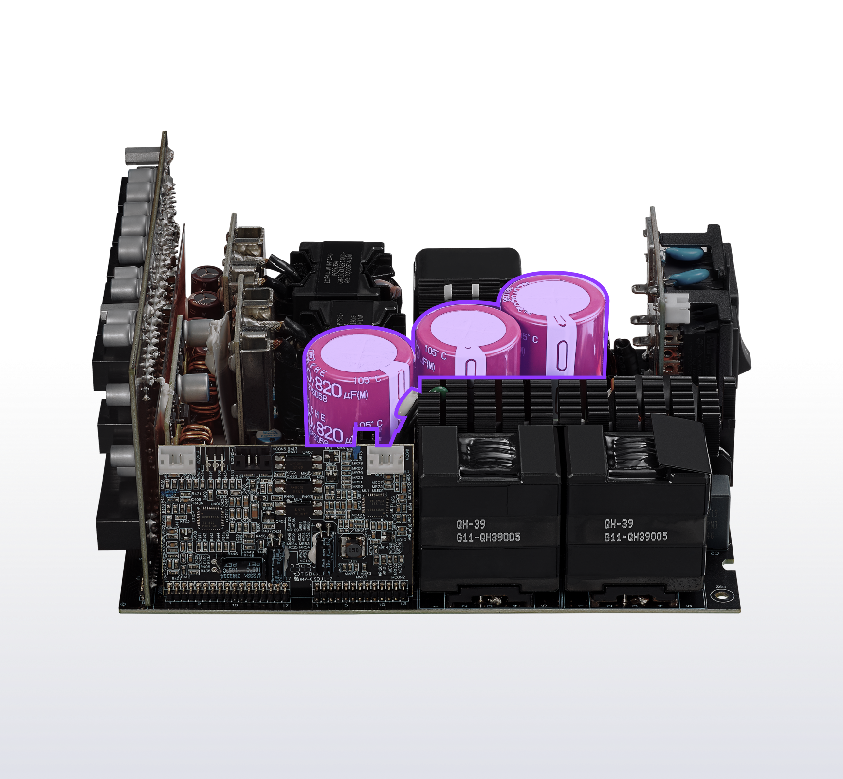 A close-up view of an exposed electronic circuit board featuring multiple components, including three large purple cylindrical capacitors, black heat sinks, and various smaller electronic parts.