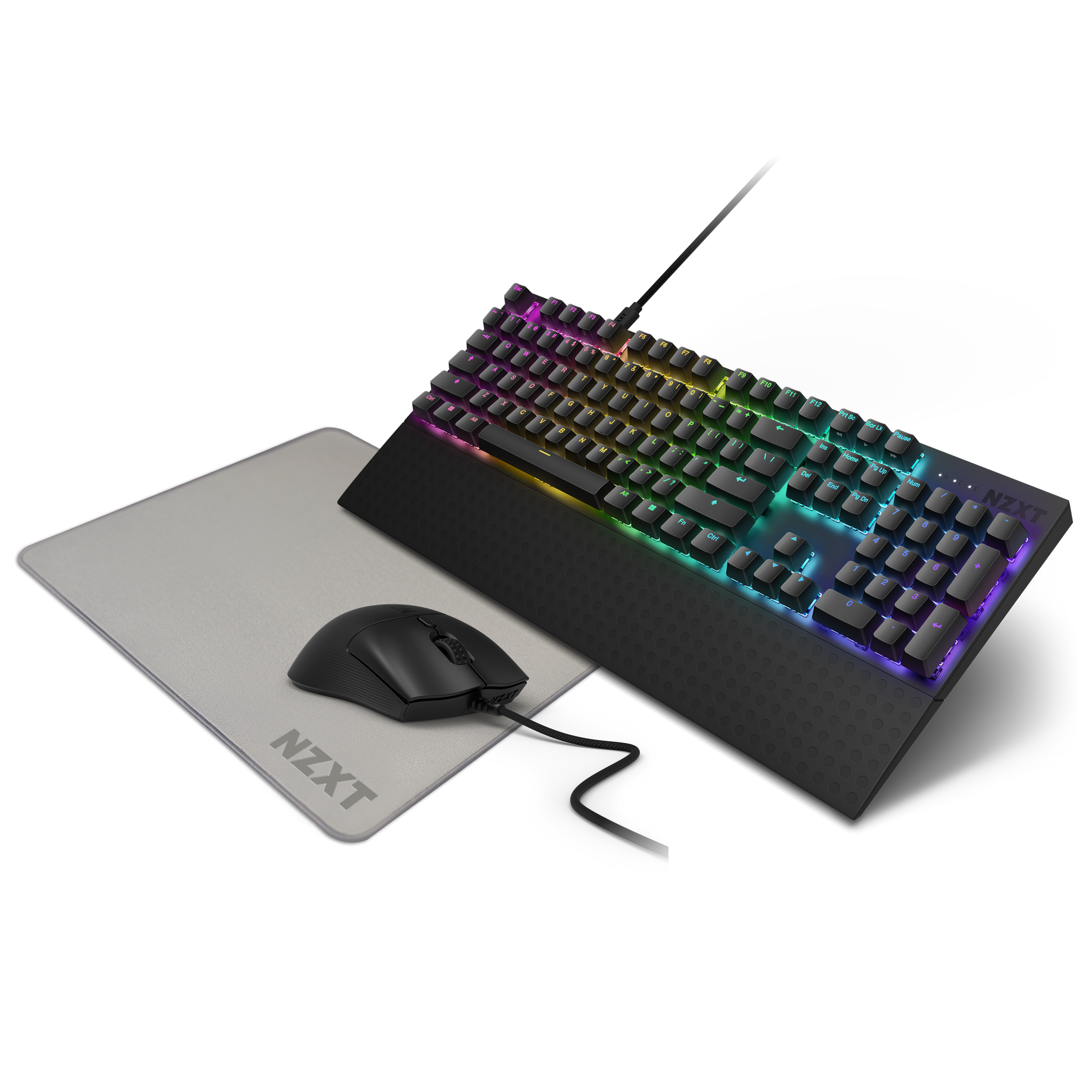An NZXT Function 2 keyboard with RGB lighting and optical switches sits beside a wired black NZXT Lift 2 Symm mouse on a light gray NZXT MMP400 mousepad, its keys glowing in a vibrant color spectrum.