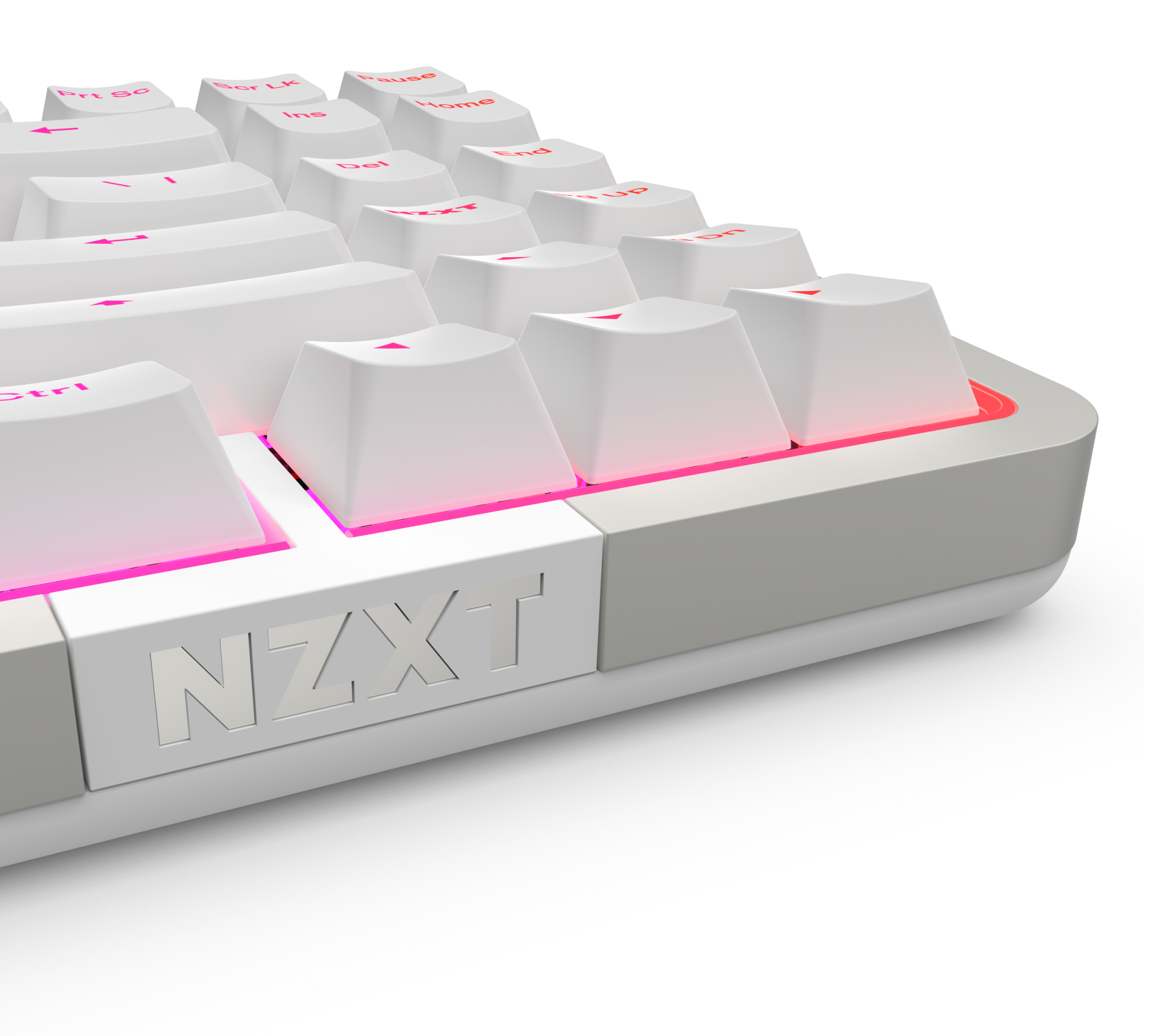 A close-up of a white NZXT mechanical keyboard with backlit pink lighting, showing raised keycaps and the NZXT logo on the front edge.