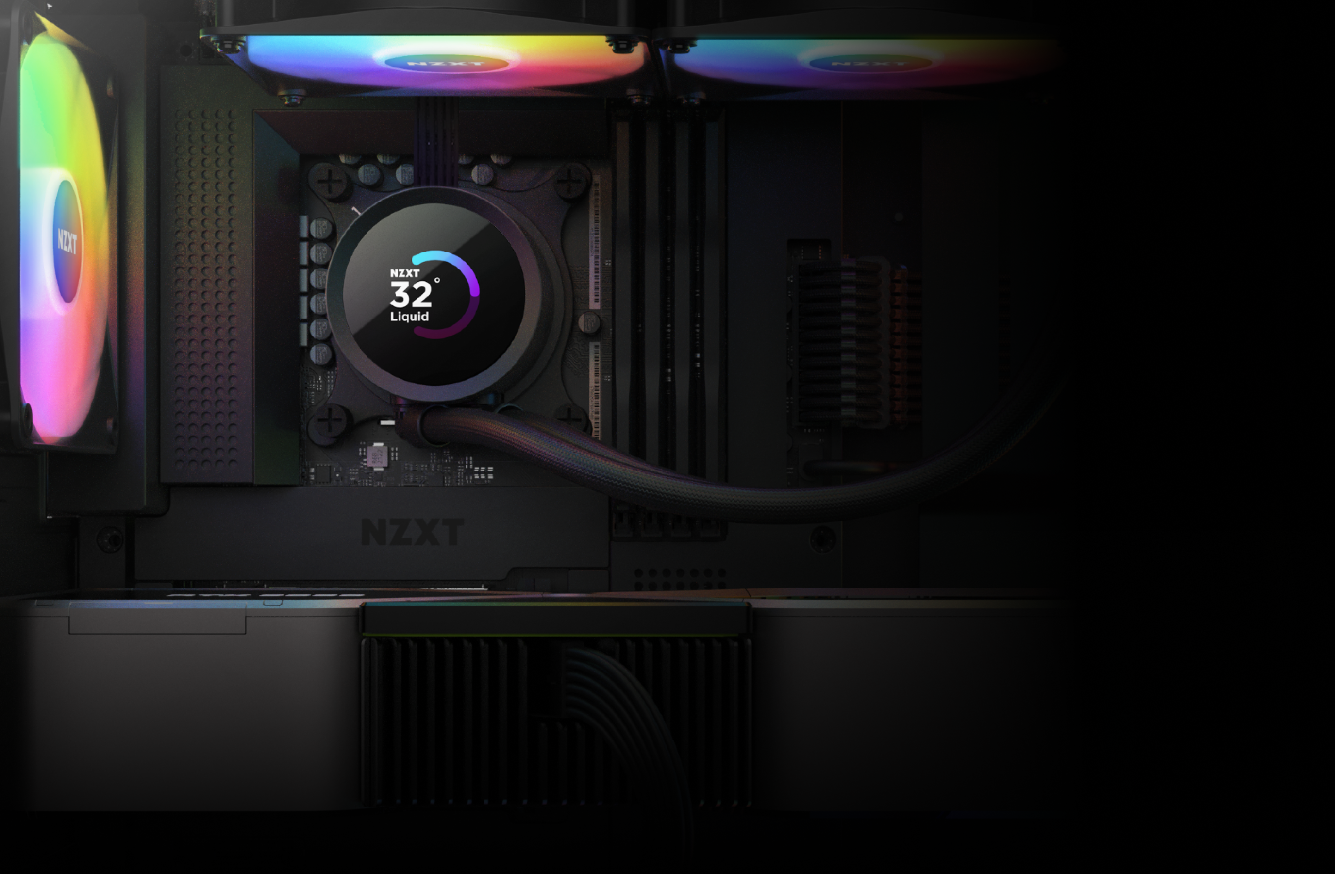 A close-up of a computer’s interior shows an NZXT CPU liquid cooler displaying a temperature of 32°C, with RGB-lit cooling fans and black cables neatly organized around the components.