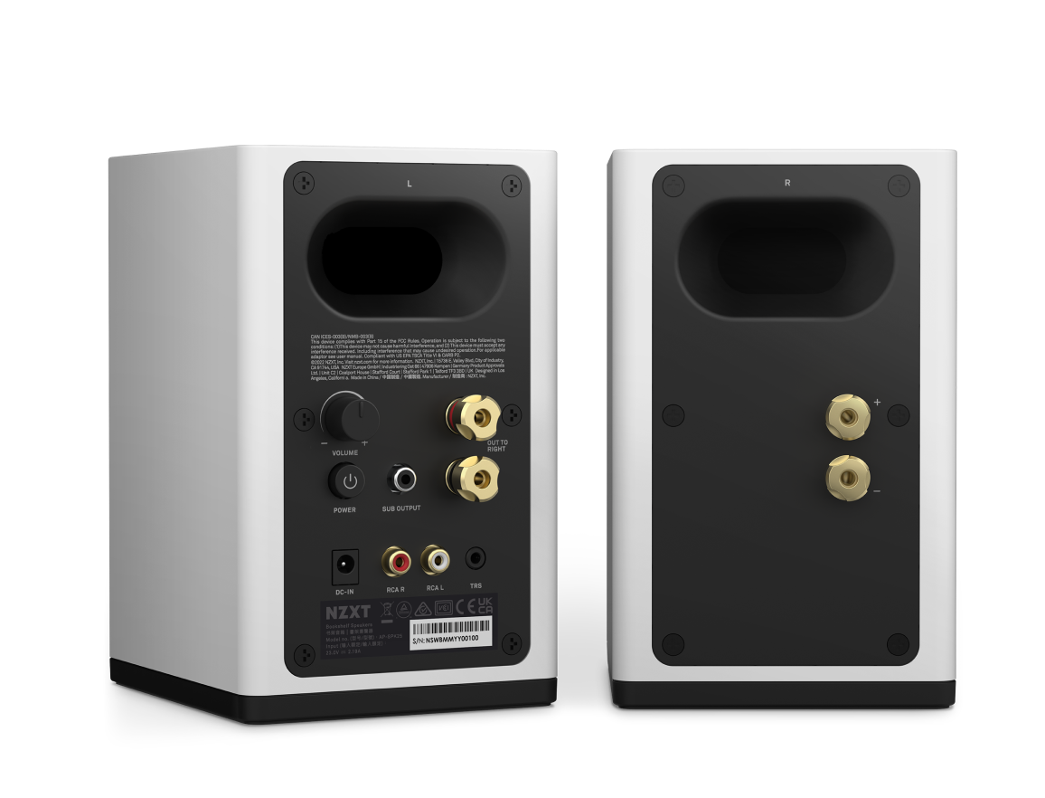 Two white rectangular speakers are shown from the back. The left speaker displays ports, knobs, labels, and connection terminals, while the right speaker shows only two gold speaker wire terminals.